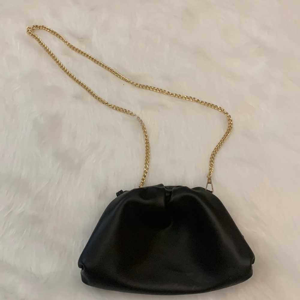 Understated Leather Crescent clutch, black vegan leather, gold crossbody chain